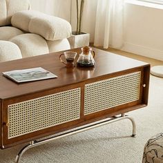 a living room with a white couch and wooden table