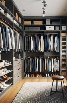 a walk in closet with lots of clothes and shoes on the shelves next to it