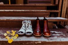 three pairs of shoes are sitting on the steps