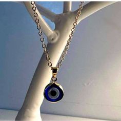 Elegant Gold Chain With A Striking Blue Evil Eye Pendant. Perfect For Any Occasion. Blue Jewelry With Chain And Round Pendant, Blue Jewelry With Round Pendant Chain, Blue Round Pendant Chain Jewelry, Blue Round Pendant Jewelry With Chain, Blue Pendant Necklace With Adjustable Chain, Blue Round Necklace With Adjustable Chain, Blue Round Necklaces With Adjustable Chain, Sterling Silver Blue Chain Jewelry, Sterling Silver Chain Jewelry In Blue