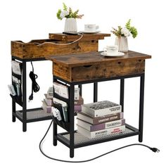 two wooden tables with books on them and an electric outlet plugged into the table