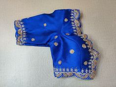 Dip your look in the gaiety of spring with this enchanting blue blouse. Tailored in silk, it features a blue zari embroidery and gets its finishing touches with hook closure at the back. Perfect blouse for festivals and parties. Buy this designer blouse in the USA from Pure Elegance. Disclaimer: The actual product may vary slightly from the image. These are custom orders, hence expect slight variation in color, placement of the motif or buta. ESTIMATED DELIVERYBecause this is a custom order, it would take about 4 weeks from the date of purchase. RETURN POLICY: This product is a custom order and cannot be returned or exchanged. Blue Silk Traditional Wear With Dori Work, Blue Traditional Drape Top For Reception, Blue Tops For Reception With Traditional Drape, Fitted Blue Blouse Piece With Intricate Embroidery, Blue Blouse For Eid Reception, Blue Elegant Blouse For Eid, Traditional Embroidered Top With Dori Work For Party, Designer Blue Blouse For Eid, Traditional Embroidered Top With Pallu For Party