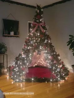 a christmas tree with lights and decorations on it