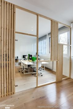 an office with wooden slats and glass walls