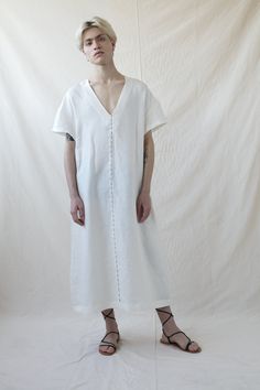 Unique white maxi dress, Minimalist natural linen dress tunic, Loose white unisex dress, Kaftan for men, Will be Perfect as a gift. Unique minimalist dress in white. This tunic dress is not only extremely comfortable and flattering but also very versatile with a relaxed A shape, A V-neck forms a delicate look with short sleeves, Made from pure linen and sewn with extreme precision by the hand of a tailor. An embroidered stitch on the shoulders gives this urban tunic dress an artistry look. Wear Relaxed Fit Maxi Length Linen Dress For Daywear, Relaxed Fit Linen Maxi Dress For Daywear, White Linen V-neck Midi Dress, White Linen V-neck Maxi Dress, Elegant White Relaxed Fit Maxi Dress, Elegant White Linen Dress With Relaxed Fit, Elegant White Relaxed Fit Linen Dress, Oversized Linen V-neck Maxi Dress, Oversized Linen Maxi Dress With V-neck