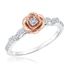 a rose ring with diamonds on it