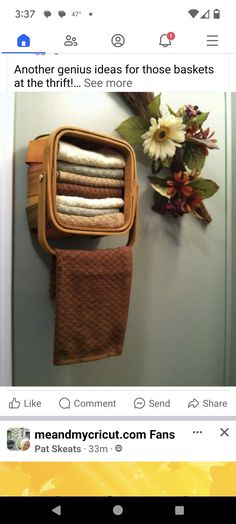 an image of towels hanging on the wall in front of a basket and towel rack