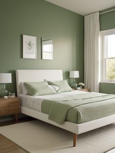 a bedroom with green walls and white furniture