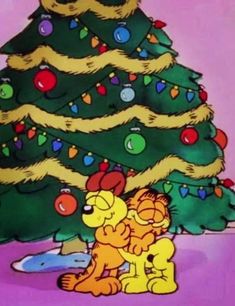 garfield the cat and his friends are sitting in front of a christmas tree with presents on it