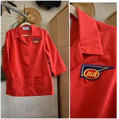 1970s retro cherry red IGA supermarket uniform work shirt // workwear jacket with wide sleeves, retro butterfly collar, and patch pockets. Looks like something a gas station attendant, butcher, or mechanic would wear. Loose tented fit. By Angelica. Wash and wear! Technically womens but fits like a unisex large Shoulders 18" Chest 48" Sleeve 19" Arm Hole 11" Length 29.5" Supermarket Uniform, Work Vest, Gas Station Attendant, Uniform Shirts, Workwear Jacket, Work Uniforms, Work Jackets, Cherry Red, Wide Sleeves