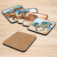 four coasters with horses painted on them sitting on a table next to a cork coaster