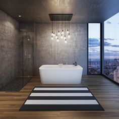 a bathroom with a large bathtub next to a walk in shower and a big window