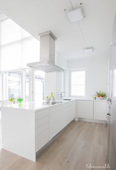 a black and white photo of a kitchen