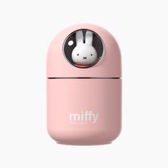 a pink object with a white rabbit in the center and words miffy on it