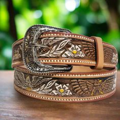 Embossed Brown Leather Belt for Women🌼 This leather belt for women is a dream accessory; a versatile piece you'll love and wear forever. Sumptuous leather in brown tones is embossed with flowers and eagles and finished with a classic engraved buckle. The vintage vibe and Western-inspired design make it the perfect partner to your trusty blue jeans and boho style. *Made of genuine leather and has a metal buckle *Handmade by  talented artisans for an authentic look *Embossed leather, engraved buc Belt Cowgirl, Rodeo Gifts, Cowgirl Belt, Leather Engraved, Belt For Jeans, Casual Leather Belt, Cowgirl Belts, Handmade Belt, Handmade Leather Belt