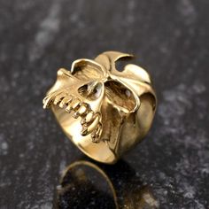 Handmade Skull Ring, Gothic High skull Ring Gold Skull Ring Punk Motorcyclist Ring Skeleton Ring Satanic Ring Gift ♥DETAILS♥ *Materials: Brass *Handmade Jewelry ❥ Add this beautiful one little thing of galactic shine to make you feel unique and to transform your lives. Perfect for any kind of outfit and every occasion. ❥ Customers satisfaction is our biggest priority, please contact us with any questions/queries for future or existing orders, and we will do our best to make sure you are happy wi Biker Jewelry For Halloween Gift, Biker Style Jewelry For Halloween Gift, Biker Style Halloween Jewelry Gift, Biker Skull Jewelry For Gift, Biker Style Skull Jewelry For Gift, Biker Style Skull Jewelry Gift, Punk Skull Rings As Gift, Gothic Gold Skull Ring For Halloween, Punk Style Skull Shaped Metal Rings