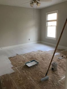 an empty room is being painted with white paint