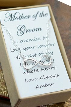 a necklace in a box with an inscription on it that reads, mother of the groom