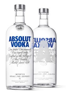 two bottles of absolut vodka next to each other