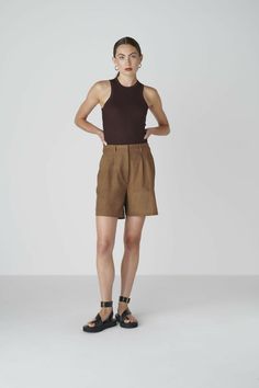 Want to look elegant and show a bit of leg? Discover the Bièl shorts in Cappuccino Brown. These shorts feature a high and slim fit at the waist, with a relaxed fit in the leg. They include a double pleat and two side pockets. The Bièl shorts are perfect for the warmer summer days, but also look stunning in the winter when paired with tights and boots. Complete your look with the matching June Jacket.The fabric is a mix of organic and recycled cotton. The yarns are traditionally plant dyed with b Chic Brown Short Bottoms, Chic Brown Short Length Bottoms, Chic Short Length Brown Bottoms, Brown Shorts For Workwear, Brown Workwear Shorts, Fitted Brown Bottoms With Short Inseam, Brown Summer Workwear Shorts, Brown Shorts For Summer Workwear, Brown Fitted Shorts