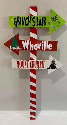 a wooden sign that says grinch'slarr, whoville and mount crumpt