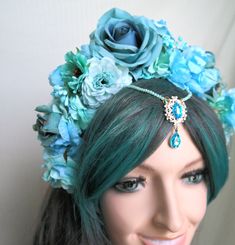 Blue fairy Flower Crown Fascinator. Blue Flower Headband Fascinator. Water Fairy, Fantasy, Mermaid. This spectacular, lush flower crown, is made of flowers, roses, a beautiful jeweled centerpiece. Feminine and pretty this headdress is ideal for making a statement. It can be a great addition to any fairy fantasy costume . Can be used as a pagan, carnival headpiece, for a garden weddingor tribal headpiece . It is lightweight, comfortable to wear and beautiful from the back view as well. Based upon Water Fairy Costume, Carnival Headpiece, Flower Crown Fairy, Princess Jasmine Cosplay, Jasmine Halloween Costume, Fairy Flower Crown, Adult Fairy Costume, Blue Flower Headband, Crown Fairy