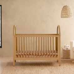 a baby crib sitting in the middle of a room