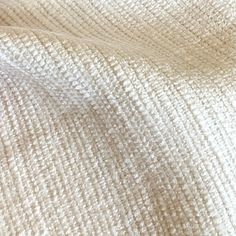 the texture of an upholstered white fabric