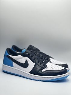 a pair of sneakers with blue and white accents