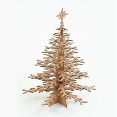 a small wooden christmas tree on a white background