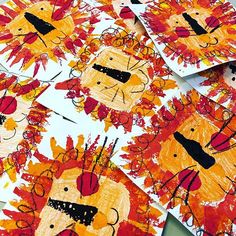 the children's art project is made with autumn leaves and lion faces on paper