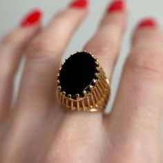 Stunning hand made statement ring made of 18KT yellow gold. It's unique design of high basket holds an oval cut onyx gem with twenty prongs.  Pre-owned item.  Ring Size 6  Weight: 6.63g Stamped 18KT gold **FREE shipping within Canada and USA** If you have any questions or concerns, please do not hesitate to contact us. We will be more than happy to help you and answer any inquiries.  We invite you to check out our shop for more fabulous items! Dinner Ring, Gold Basket, Black Stone Ring, Protection Stones, Black Stone, Stone Ring, Statement Ring, Rings Statement, Oval Cut