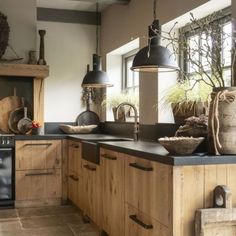 a kitchen with wooden cabinets and black appliances