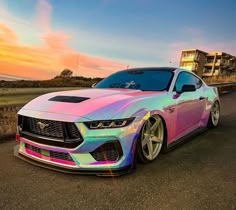 a colorful car parked on the side of a road