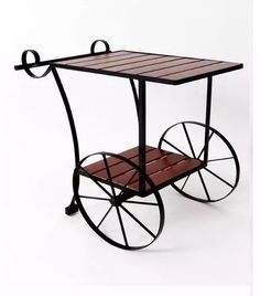 a small wooden cart with wheels is shown on a white background for use as a side table