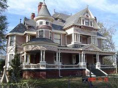 an old victorian style house is shown in the daytime