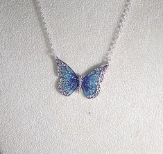 Pretty enamel and imitation rhodium-plated, 35x25mm single-sided butterfly - shown here in blue and green with glitter (6 color choices - see photos). Necklace is made with silver filled rolo chain with a lobster clasp - select length during checkout. Comes in a gift box. Photos - 1, 2, & 3 = Blue and Purple Photo 4 - Black Photo 5 - Green Photo 6 - Orange Photo 7 - Pink Photo 8 - Purple Orange Photo, Butterfly Necklace Silver, Purple Photo, Pretty Jewelry Necklaces, Pink Photo, Green Photo, Magical Jewelry, Jewelry Accessories Ideas, Girly Accessories