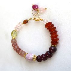 "This is such an effortless and elegant bracelet - a wonderful way to wear fine gemstones everyday... I offer this design in a number of different stone variations and combinations...Here, plump, vibrant multiple gemstones create a striking bracelet. The 22kg vermeil embellishments create a luxe look and beautiful luster. The length is a 7\" long and secures with a gold vermeil clasp. Adjustments can be made, please inquire. Stack a few of the layering bracelets together for a very chic wrist fu Modern Everyday Bracelets With Gemstone, Elegant Multicolor Agate Bracelets, Fusion Style Beaded Bracelets With Gemstones, Fusion Style Gemstone Beaded Bracelets For Healing, Multicolor Gemstone Rondelle Bracelets, Rondelle Agate Jewelry With Natural Stones, Agate Rondelle Natural Stone Jewelry, Elegant Natural Gemstones For Healing, Modern Bracelets With Gemstone Accents For Gift