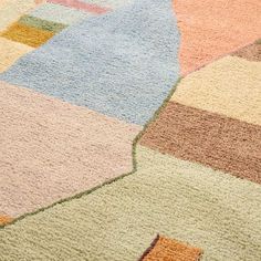 a multicolored area rug on the floor