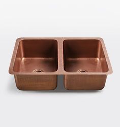 copper double bowl kitchen sink with two holes in the front and one on the side