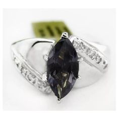 Karat: 10k White Gold Gem Type: 1 Lab Created Alexandrite - 1.50 Carats Alexandrite Grades, Hue . . . Changing Color From Greenish To Purplish Tone . . . . Medium Dark Saturation . . . Vivid Cut . . . Excellent No Inclusions Or Flaws 8 Genuine Diamonds - 0.015 Ct Each Diamond Grades, Clarity Grade . . . I1 Color Grade . . . Ij Size 6.25 (Resizing Service Available If Needed) Type Of Setting : Prong Shape Of Stone : Marquise & Round Dimensions : 10 Mm X 5 Mm - Main Gemstone Measurements Resizing Paraiba Tourmaline Ring, Avon Rings, Ruby Bands, Moonstone Ring Sterling Silver, Swirl Ring, Gold And Silver Rings, Textured Ring, Luxury Rings, Tourmaline Crystal