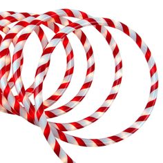 several red and white candy canes on a white background