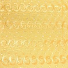 a yellow background with white circles and dots