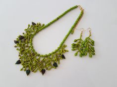 Necklace and earrings of green / mossy glass round and left beads, small green and bronze beads, gift for her, present for women Length of necklace 15.75 inches (40 cm). It can be extended up to 2.36 inches (6 cm) Length of earrings 2.26 inches (6 cm)  Necklace and earrings are ready to ship. By purchasing more from this listing you save postage. You can choose unique handmade gifts for women from my stores https://www.etsy.com/shop/Reriros and https://www.etsy.com/shop/ReriroHandmade It is made Handmade Green Beaded Earrings With Czech Glass, Green Czech Glass Jewelry With Dangling Beads, Bohemian Green Beaded Necklaces With Bead Caps, Handmade Green Jewelry With Czech Glass, Bohemian Green Necklaces With Matching Earrings, Handmade Green Czech Glass Jewelry, Green Czech Glass Jewelry Gift, Bohemian Green Necklace With Matching Earrings, Green Round Beaded Jewelry With Bead Caps