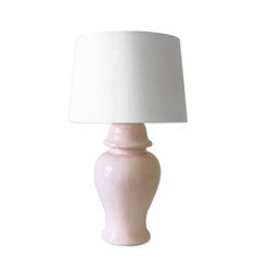 a pink table lamp with a white shade