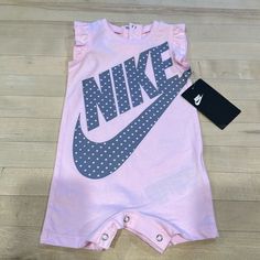 Nike Baby Girl Onesie Outfit. Brand New With Tag - Never Worn. 6m Size. Light Pink With Gray Print. Pink Cotton Onesie For Spring, Playful Pink Onesie For Playwear, Pink Onesie For Summer, Pink Fitted Onesie For Playtime, Pink Onesie With Letter Print For First Birthday, Pink Sleeveless Onesie, Casual Pink Onesie For Playtime, Playful Pink Short Sleeve Onesie, Cute Pink Short Sleeve Onesie