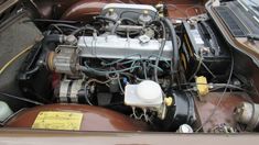 the engine compartment of an old car is shown