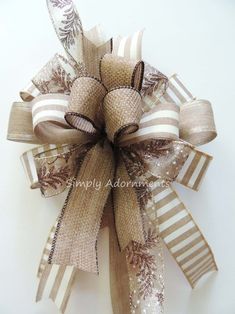 a close up of a bow made out of burlock and ribbon with snowflakes on it