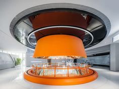 an orange circular object in the middle of a room