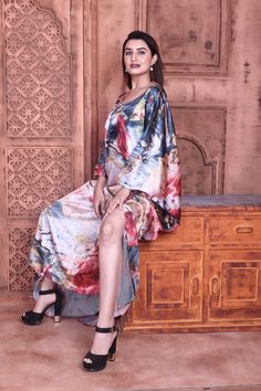 This beautiful long silk Kaftan. The graceful colour in background beautifully complements the bright to bring out the best in you. Dress up to shine with a messy hair bun, copper accessories and wedges. The round neckline adds a dash of glamour to the attire. An ideal pick to go on a brunch party or an easy afternoon with your girls. Let that stylish look you always dreamt of, come alive with this Kaftan. One size fits all (Free size)FABRIC •Silky satin ( The fabric is totally soft, cool, not s Party Wear Kaftan Dress, Elegant Floor-length Silk Kaftan, Multicolor V-neck Kaftan For Loungewear, Multicolor Silk Free-size Kaftan, Multicolor Flowy V-neck Kaftan, Messy Hair Bun, Kaftan Gown, Silk Floral Print Kaftan For Beach Cover-up, Copper Accessories